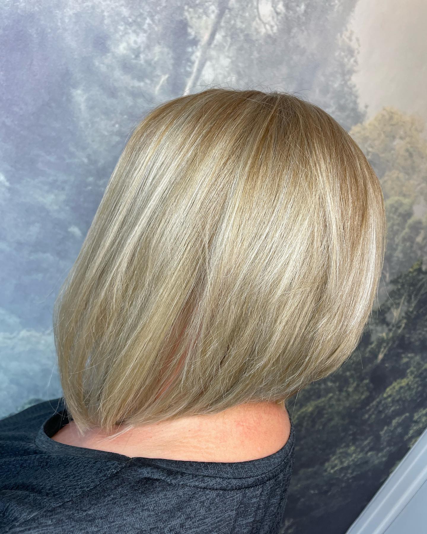 Sleek blonde bob with precision cut and soft dimension