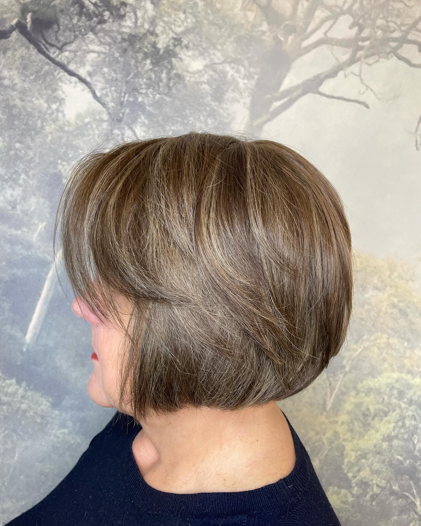 Textured bob haircut with soft brunette tones and volume