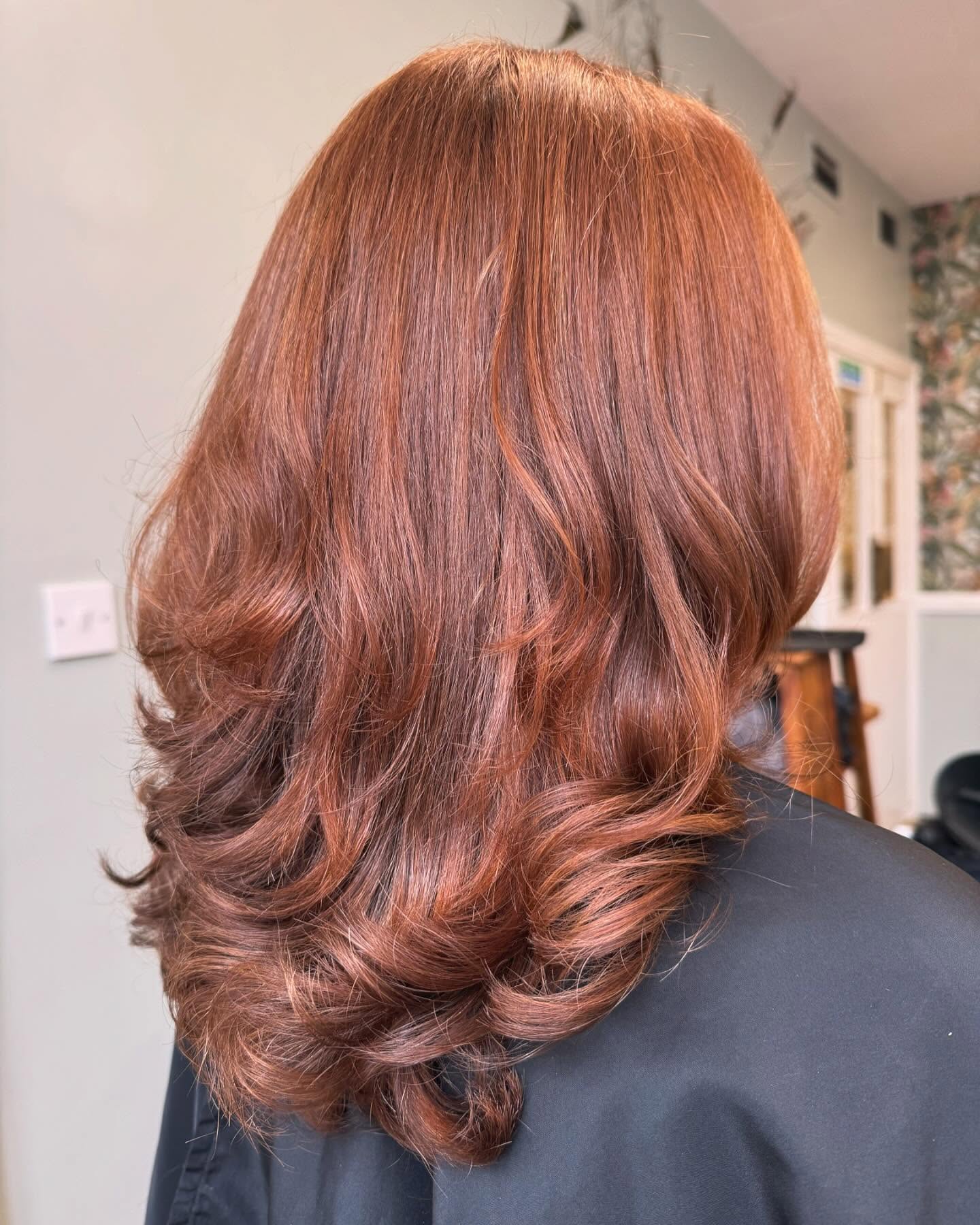 Copper-toned layered haircut with movement and shine