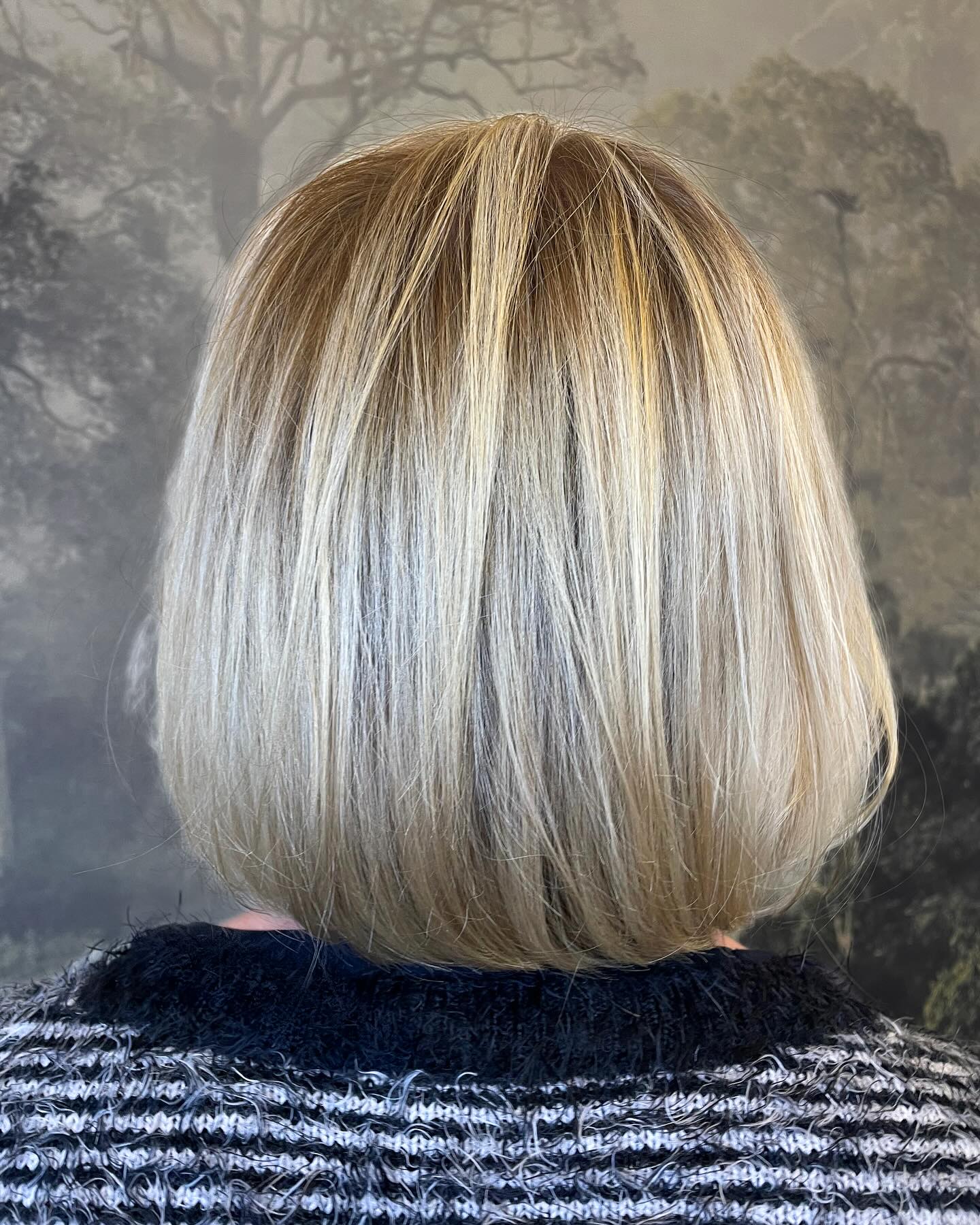 Blonde bob with soft dimension and bright face-framing highlights