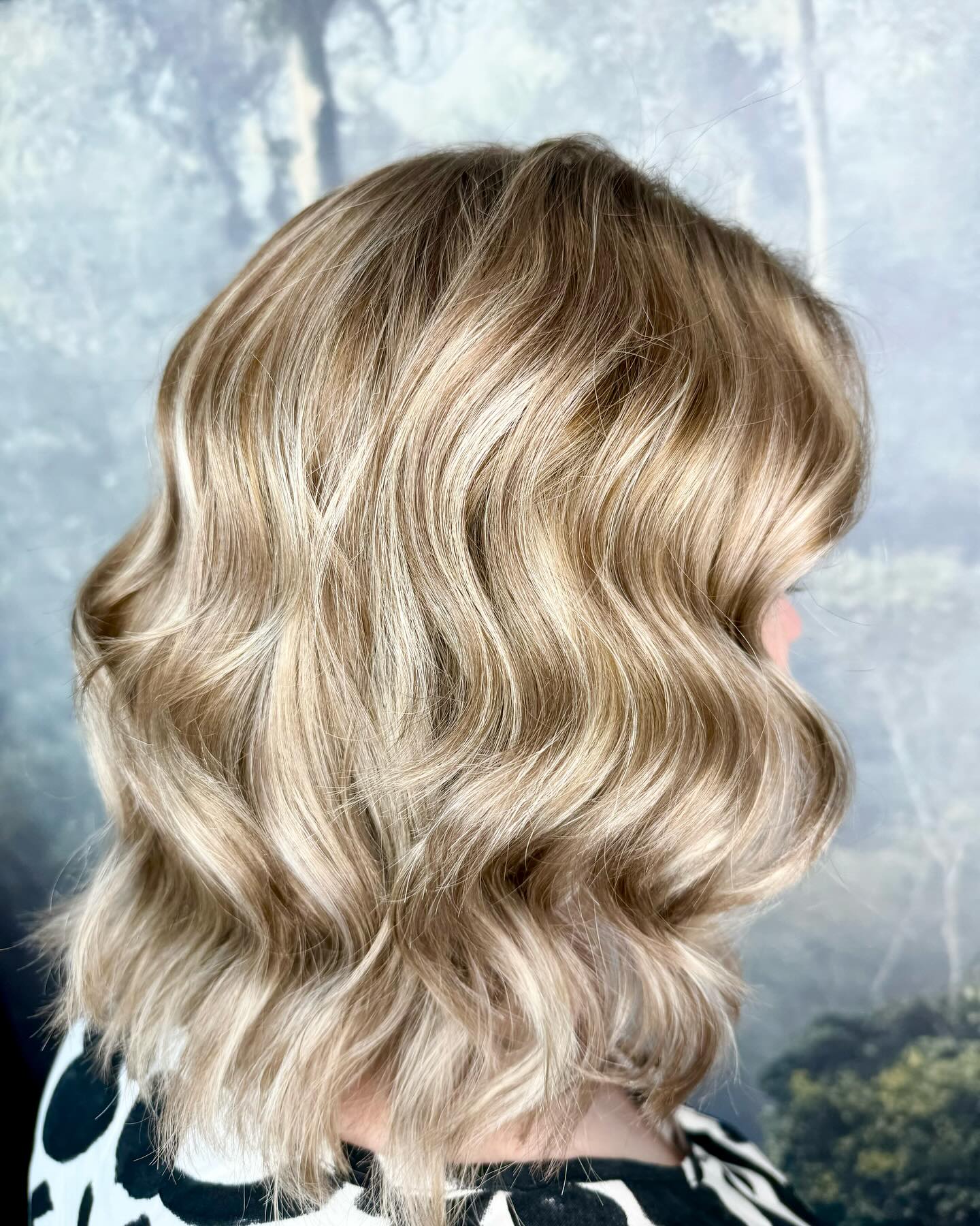 Soft blonde bob with creamy tones and textured waves