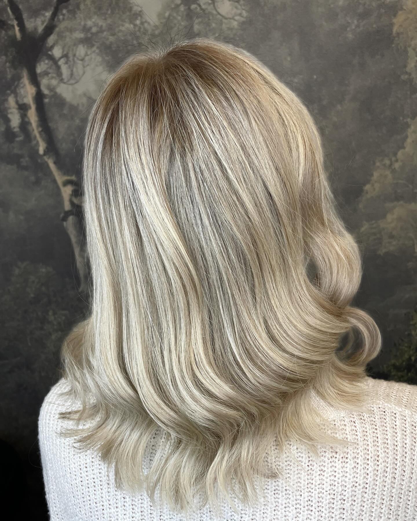 Bright icy blonde colour with smooth styling and dimensional root melt