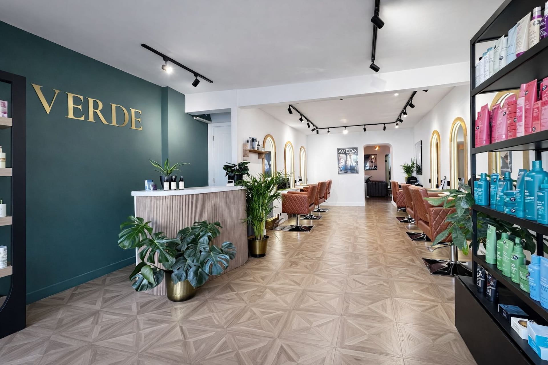 Interior of Verde Hair Lounge featuring luxury styling stations and Aveda products